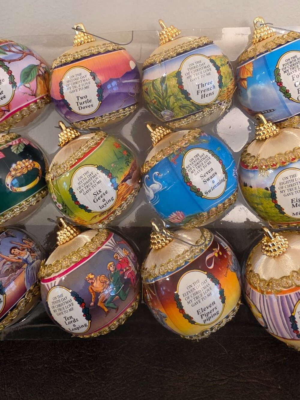 vintage set of 12 Days of Christmas ornaments features round satin balls in mul